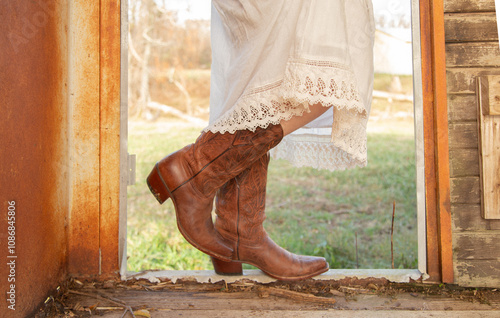 cowboy boots in field with vintage lace