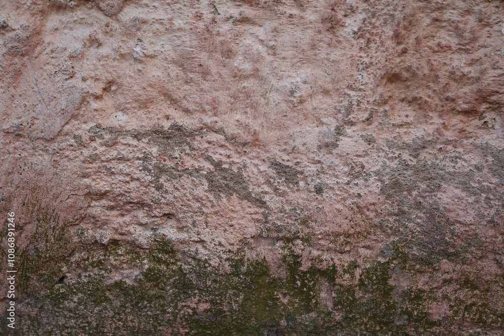 Mur de pierre peint en rose qui s'effrite Mur de pierre peint en rose qui s'effrite