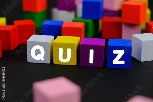 the words Quiz on wooden blocks. the concept of answering quizzes or quiz games. the concept of answering quizzes or quiz games. text space