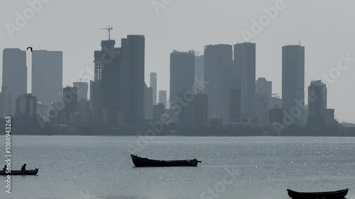 Fishing Boats With a Backdrop of Bandra Worli Sea Link in Mumbai, India photo