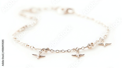 Elegant bracelet with charm details, white isolated background.