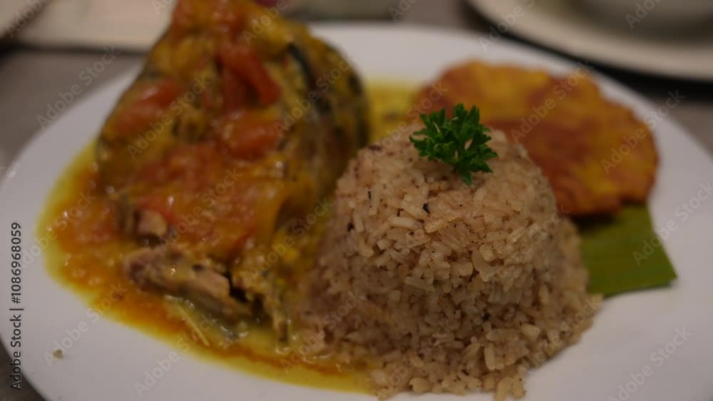 Coconut Rice with Catfish and Fried Plantain. Close Up Coconut Rice with Catfish and Fried Plantain. Close Up