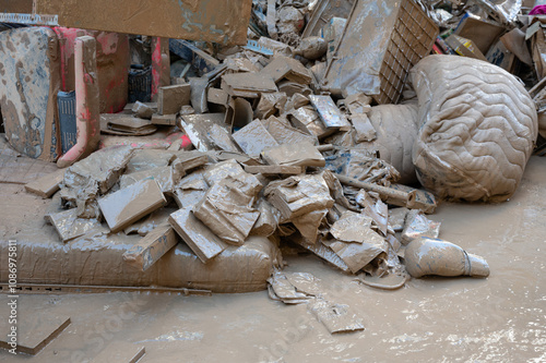 Bilde på lerret Household items covered in mud and debris, illustrating severe flood damage in V