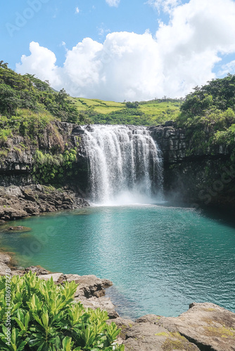 Serene Waterfall in Lush Green Landscape photo