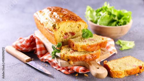 Canvas Print french savoury cake with ham, cheese and olives