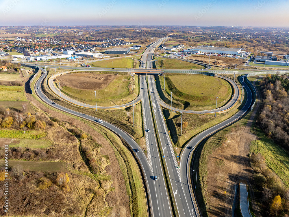 Modlnica interchange on Northern part of S52 Highway ring road around Krakow under construction. Multilevel junction with viaducts, enter and exit ramps and traffic. State on November 16, 2024