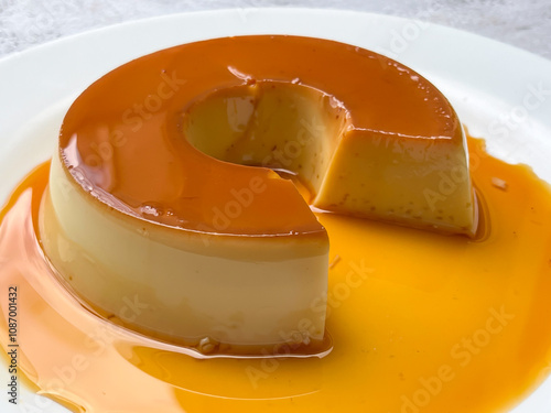 Delicious caramel custard dessert with a glossy finish. photo