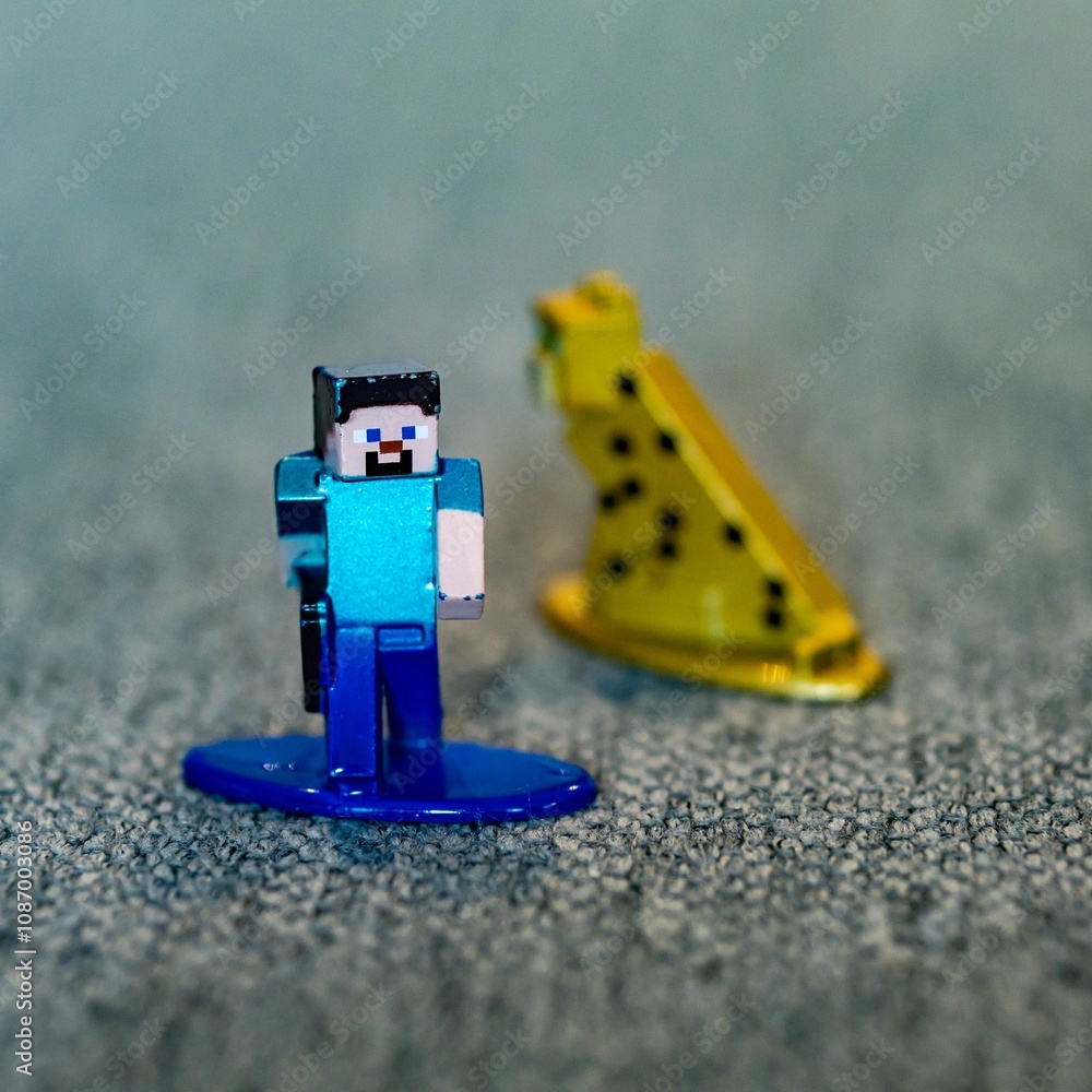Naklejka premium Closeup shot of a Minecraft Steve toy figurine made of metal