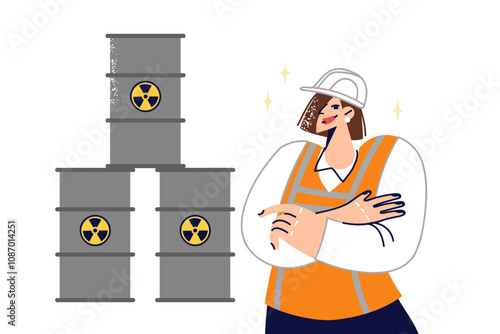 Woman stands near barrels of radioactive waste, calling for proper handling of toxic substances