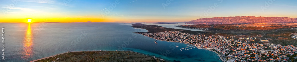 Croatia, panorama of city of Novalja on the Pag Island at sunset time. Concept travel in Croatia Croatia, panorama of city of Novalja on the Pag Island at sunset time. Concept travel in Croatia