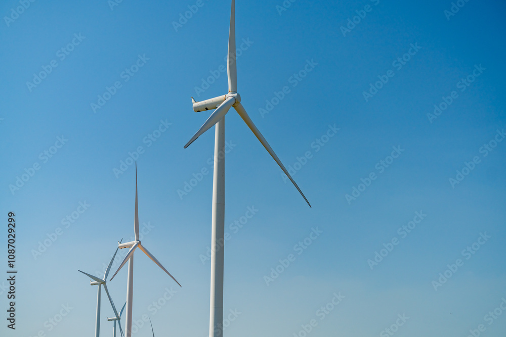 Windmills for electric power production, summer field, renewable energy Windmills for electric power production, summer field, renewable energy
