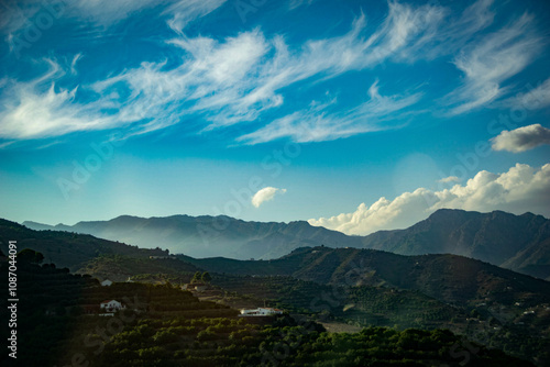 White wave of a clouds over the greenish mountains in beautiful Andalucía, Spain