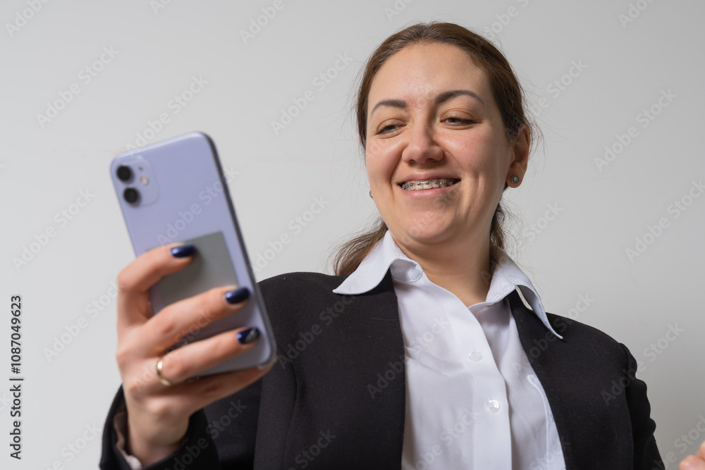 Woman wear braces using smartphone at home Woman wear braces using smartphone at home