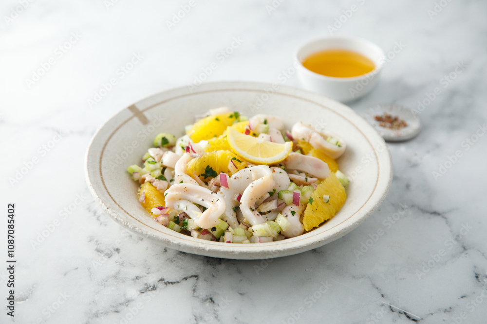 Squid salad with orange and red nion Squid salad with orange and red nion