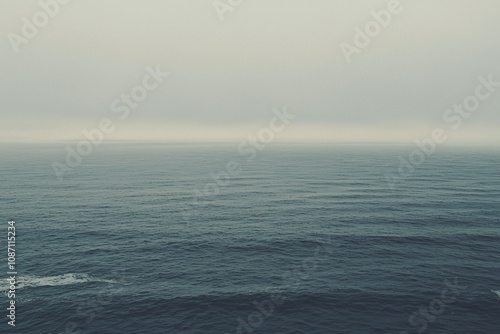 Serene Ocean Horizon: A Tranquil Seascape Under Soft Clouds