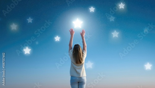 Reaching for the Stars - person standing on their tiptoes, stretching to touch stars in the sky, symbolizing ambition, dreams, and aspiration photo