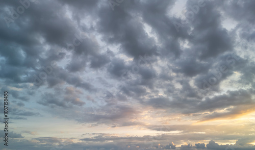 Dramatic clouds in the sky create a beautiful backdrop, reflecting soft light during sunset. Perfect for nature and landscape enthusiasts.