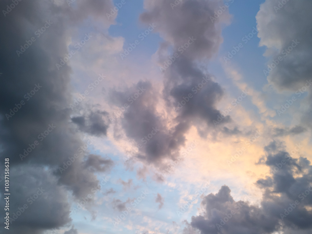 A beautiful sky filled with dramatic clouds in different shades, capturing the essence of a serene evening. Perfect for nature and atmospheric themes. A beautiful sky filled with dramatic clouds in different shades, capturing the essence of a serene evening. Perfect for nature and atmospheric themes.