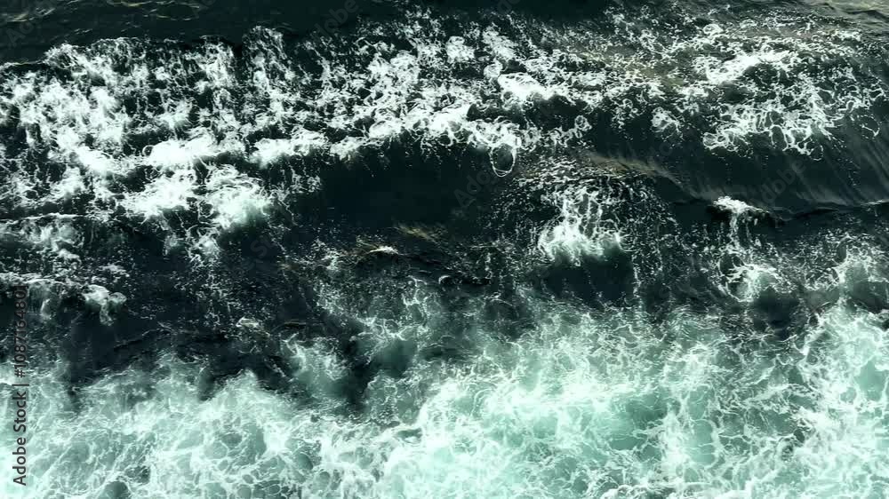 ship moving through blue sea water giving rise to wake ship moving through blue sea water giving rise to wake