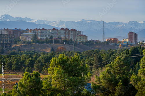 The view of Ganja, one of the largest Azerbaijan cities, with residential area and Caucasus mountain on the background.
 #1087197420