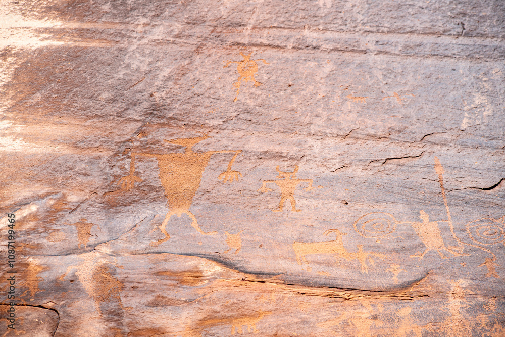 Detail of indigenous culture Petroglyphs etch in the walls along Potash Road in Moab Utah