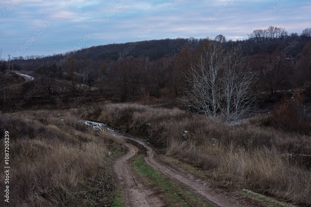 Winding dirt road through rural landscape Winding dirt road through rural landscape