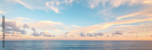 A wide shot captures a serene coastal sunset