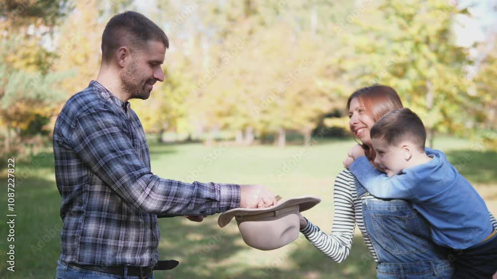 A joyful family is sharing precious moments in a beautiful scenic park, truly embodying love and togetherness A joyful family is sharing precious moments in a beautiful scenic park, truly embodying love and togetherness