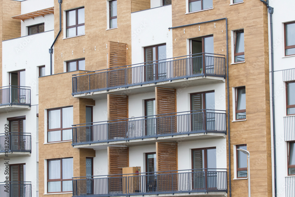 Fototapeta premium Multi-family apartment block with lots of windows