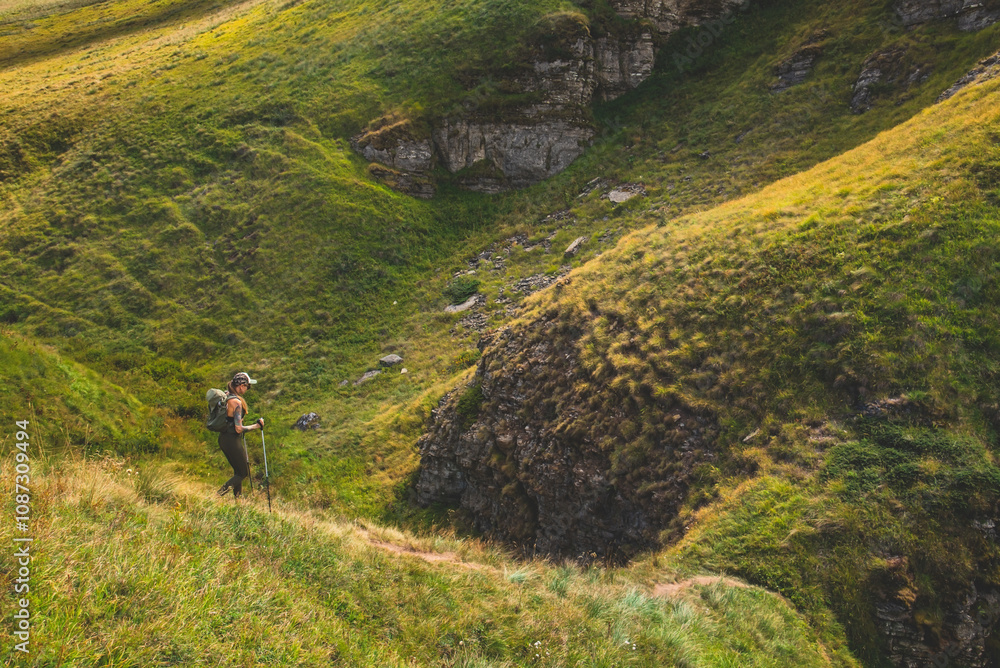 Woman Tourist Hiking Alone in Summer Mountains