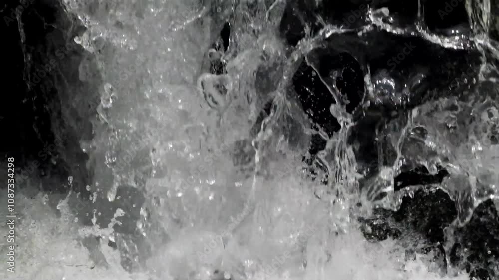 Close up of river water cascade with clear, clear water flowing fast between rocks. River flowing from the forest. Natural river seems cool and fresh. Real time. Natural light raw video no edit Close up of river water cascade with clear, clear water flowing fast between rocks. River flowing from the forest. Natural river seems cool and fresh. Real time. Natural light raw video no edit