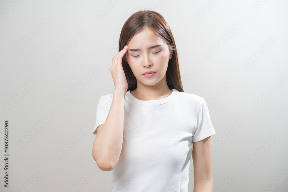 Dizzy asian young woman, girl headache or migraine pain suffering from vertigo while sitting on couch in living room at home, holding head with hand, health problem of brain or inner ear not balance. Dizzy asian young woman, girl headache or migraine pain suffering from vertigo while sitting on couch in living room at home, holding head with hand, health problem of brain or inner ear not balance.