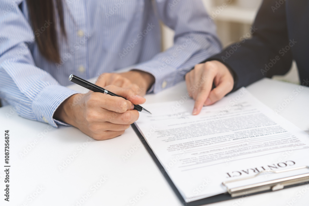 Financial, asian woman lease landlord, agent banker or bonding hand is pointing to contract of tenant, new owner or renter of home to sign signature on purchase, rental property. Estate mortgage. Financial, asian woman lease landlord, agent banker or bonding hand is pointing to contract of tenant, new owner or renter of home to sign signature on purchase, rental property. Estate mortgage.