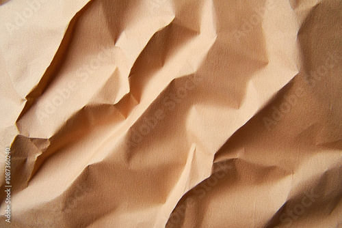 Crumpled brown paper texture with intricate folds and shadows, creating natural and organic feel. Ideal for backgrounds or artistic projects