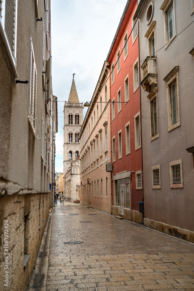 Empty street in the old town of Zadar leading to the ancient Cathedral of St. Anastasia Empty street in the old town of Zadar leading to the ancient Cathedral of St. Anastasia