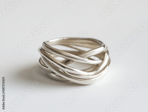 A twisted silver ring showcasing intricate design and elegance.