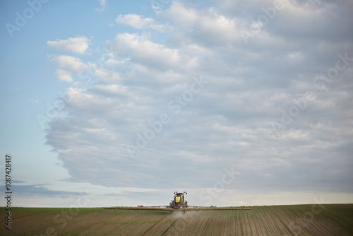 Agricultural machinery working in the field.