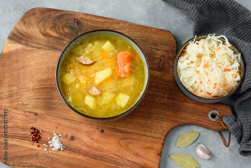 Obraz na płótnie Kapusniak, traditional Polish sauerkraut soup with potatoes and carrots w salonie