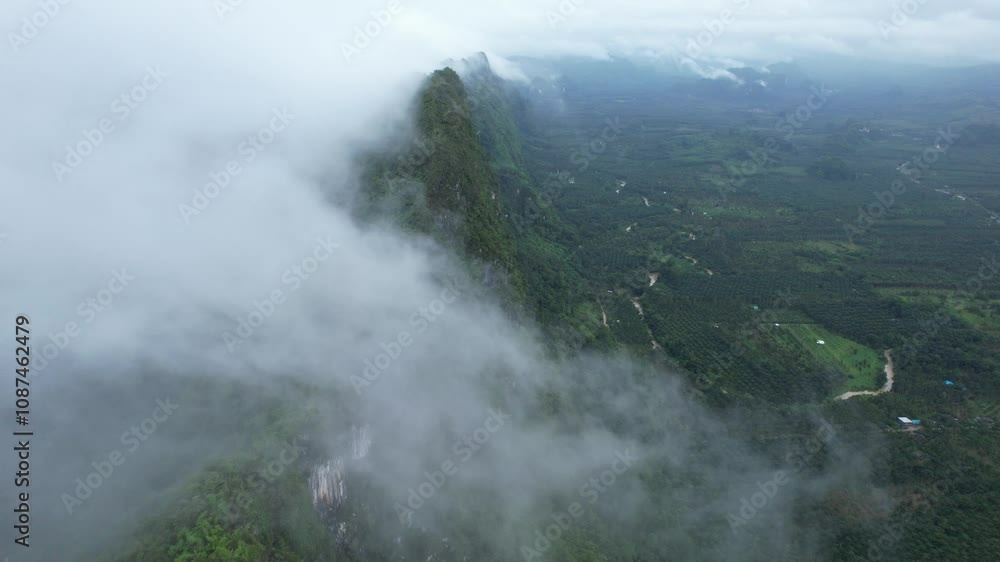 Chumpon Thailand.A mountain range covered in fog Chumpon Thailand.A mountain range covered in fog