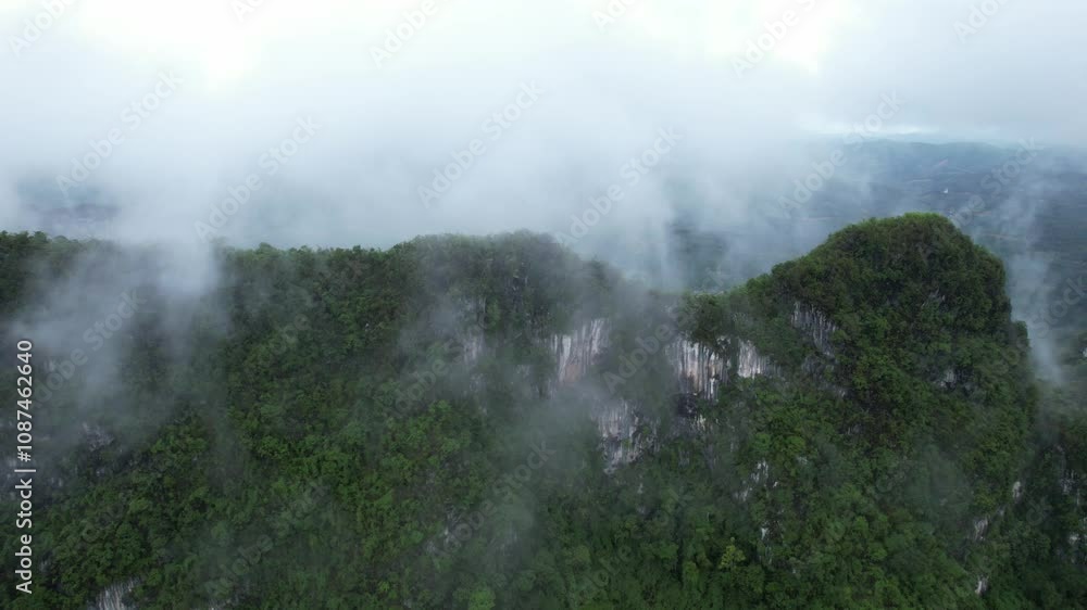 Chumpon Thailand.A mountain range covered in fog Chumpon Thailand.A mountain range covered in fog