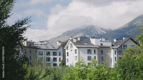 Wallpaper Mural Modern resort buildings nestled in a lush landscape with a backdrop of the Pirin Mountains. Ideal setting for relaxation and summer vacations. Torontodigital.ca