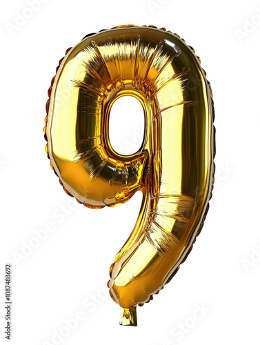 This image features a gold balloon in the shape of the number nine, standing out as a decorative piece for parties or special occasions. photo