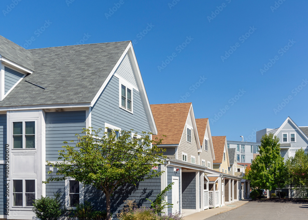 Row of modern family homes with steep gable roofs and clapboard siding in Brighton, Massachusetts, USA
Row of modern family homes with steep gable roofs and clapboard siding in Brighton, Massachusetts, USA
