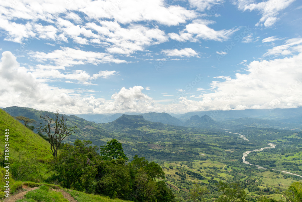 Obraz premium Beautiful natural landscape of the Poblanco river in southwestern Antioquia, Colombia with mountains in the background aerial view.