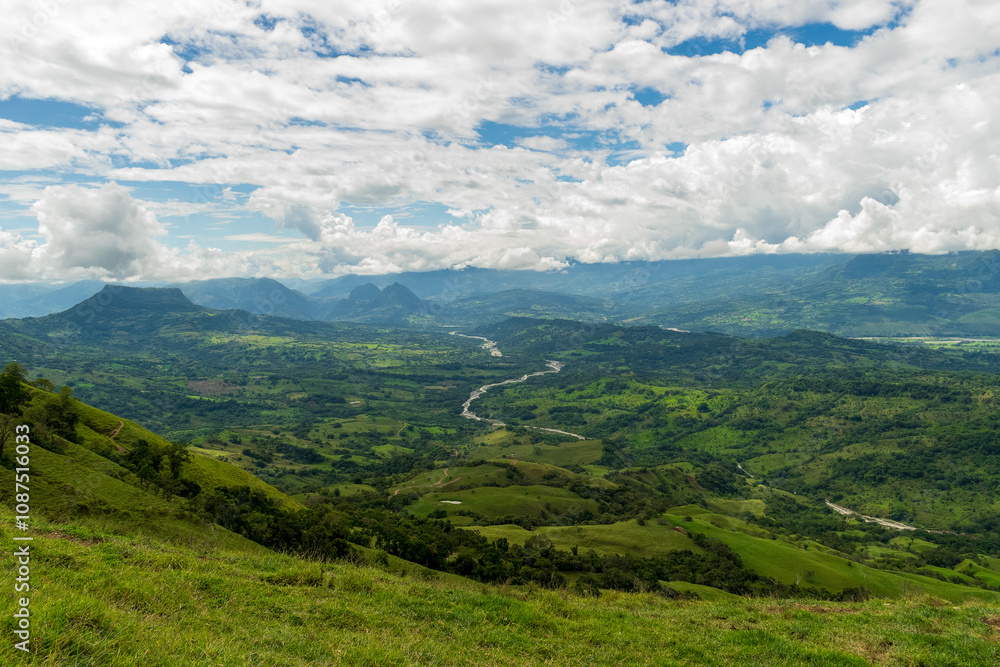 Obraz premium Beautiful natural landscape of the Poblanco river in southwestern Antioquia, Colombia with mountains in the background aerial view.