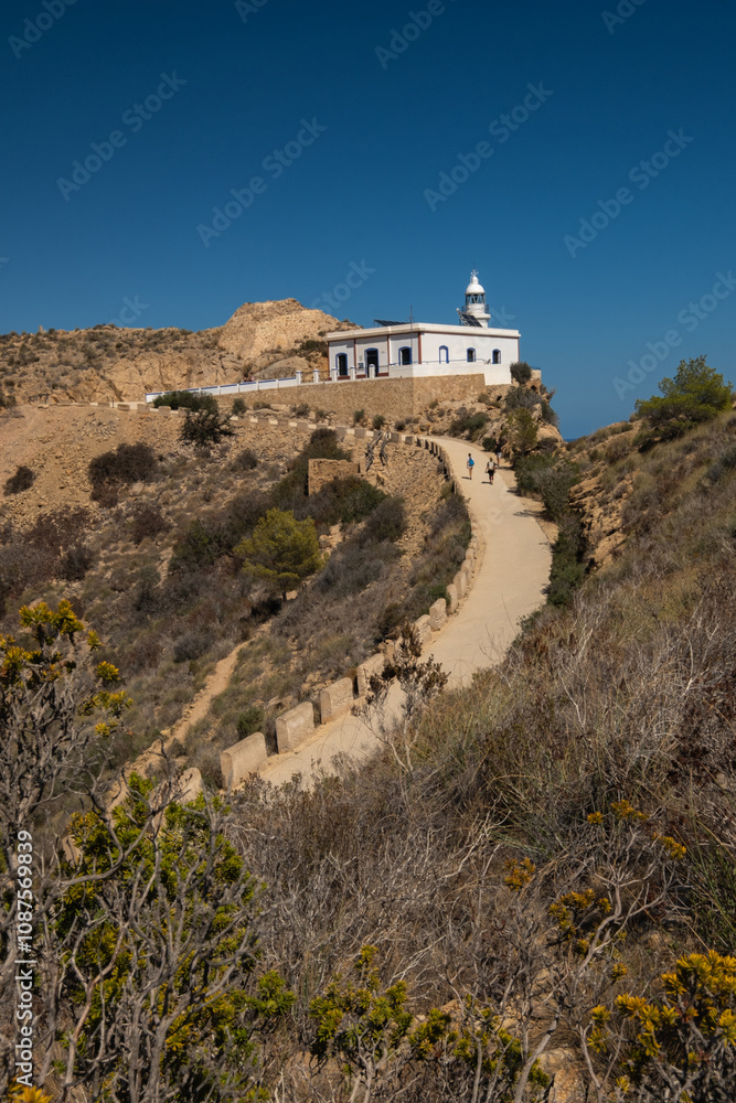 Fototapeta premium View of the lighthouse and the road to it