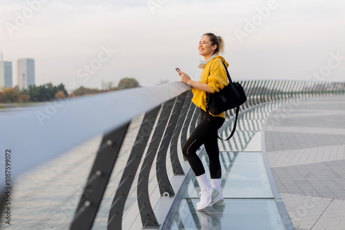 Young woman in a yellow jac...