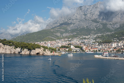 Seaside view of Makarska city surrounded by mountains, Dalmatian region, Makarska Riviera, Croatia. photo