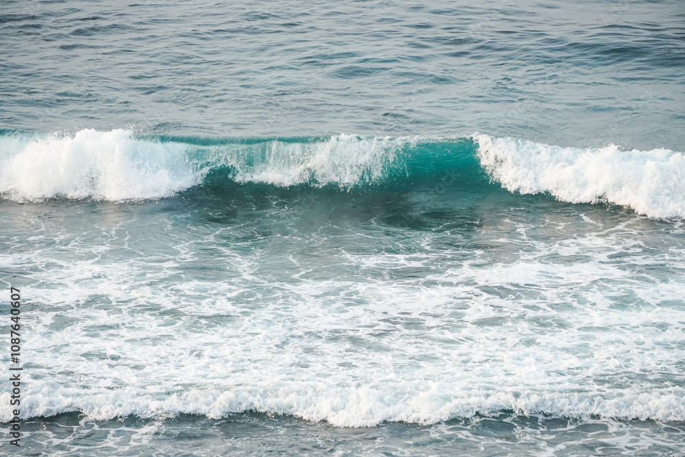 Fototapeta premium Dangerous high tide wave on the beach. Watu Karung beach, Pacitan, East Java, Indonesia.