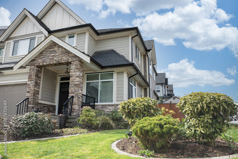 Real Estate Exterior Front House on a sunny day. Big custom made luxury house with landscaped. Real Estate Exterior Front House on a sunny day. Big custom made luxury house with landscaped.